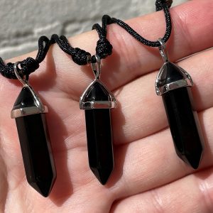black double terminated pendants on cord