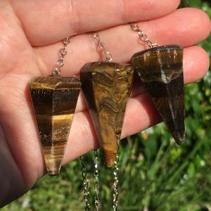 faceted tiger's eye pendulums