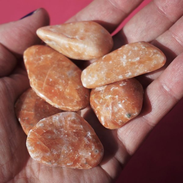 Orange calcite tumbles