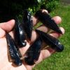 bag of black obsidian arrow heads