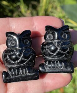 crystal owls in black obsidian