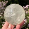 large calcite ball in pale yellow or pale golden colour