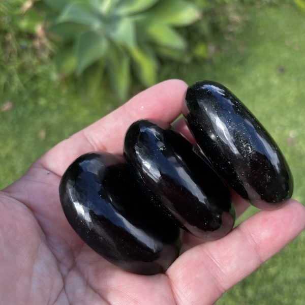 black obsidian palm stones