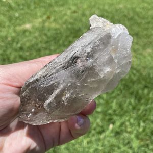 clear quartz point or cluster with inclusions