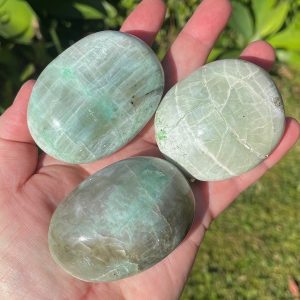 green moonstone palm stones