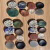 mixed set of thumb stones in iolite, strawberry quartz, mahogany obsidian, bloodstone, Dalmatian stone, clear quartz, onyx, sodalite