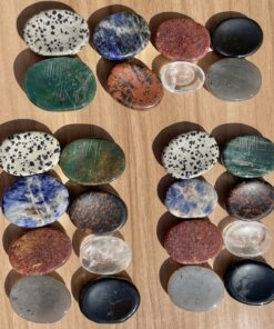 mixed set of thumb stones in iolite, strawberry quartz, mahogany obsidian, bloodstone, Dalmatian stone, clear quartz, onyx, sodalite