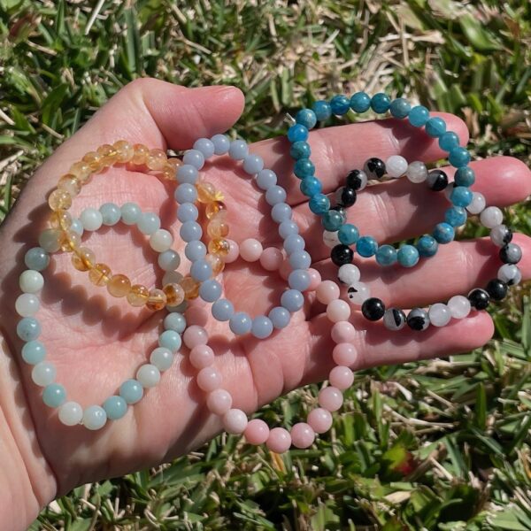 crystal bracelets in amazonite, blue apatite, tourmalinated quartz, citrine and pink opal