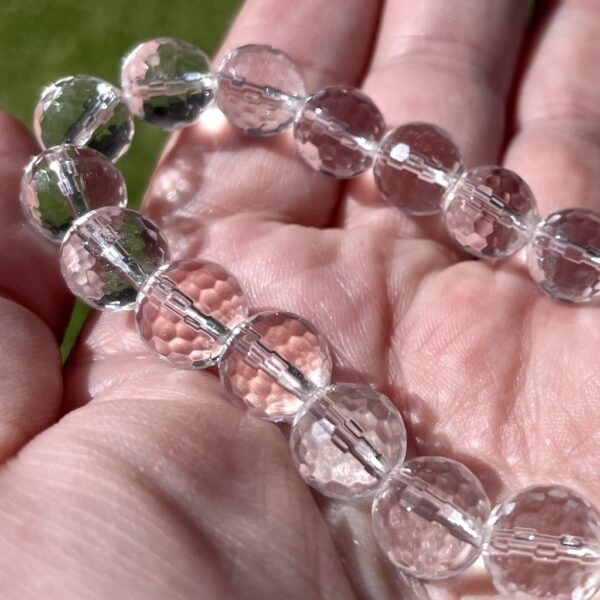 a clear quartz bracelet with faceted beads